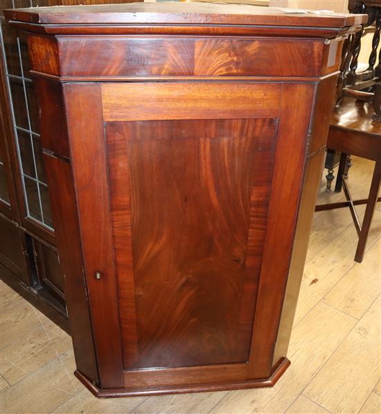 A George III mahogany corner cupboard W.87cm
